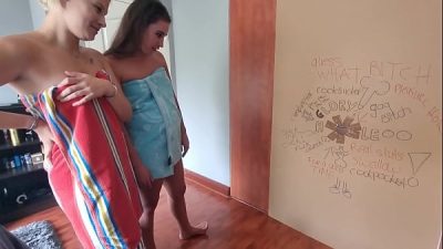 Blonde and brunette gets surprised by glory hole and both suck and play with anonymous cock