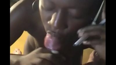 Ebony girl answering phone call while giving head