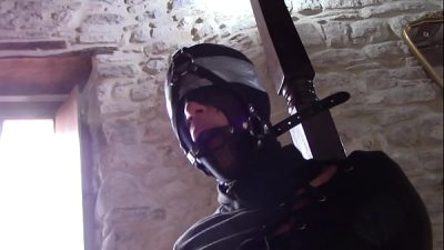 Laura XXX is tied up, masked with nylon and blindfolded. She has to deepthroat a cock without mercy