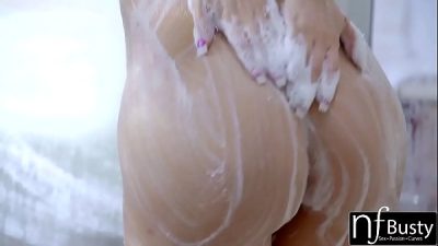 When sexy blonde Kagney Linn is soaping up her big fake tits in the shower her man can’t resist